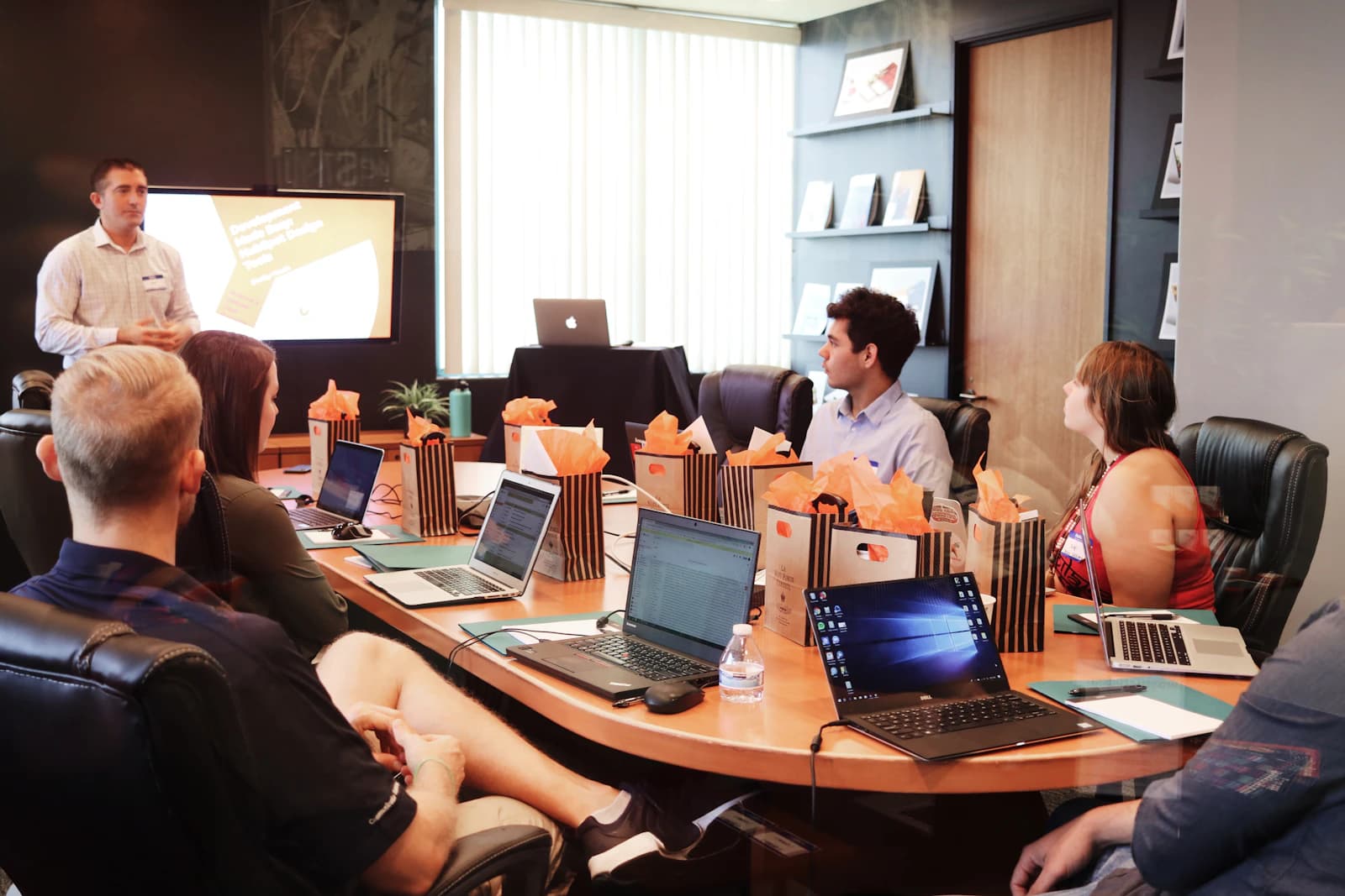 A team discussing meeting materials during a workshop.