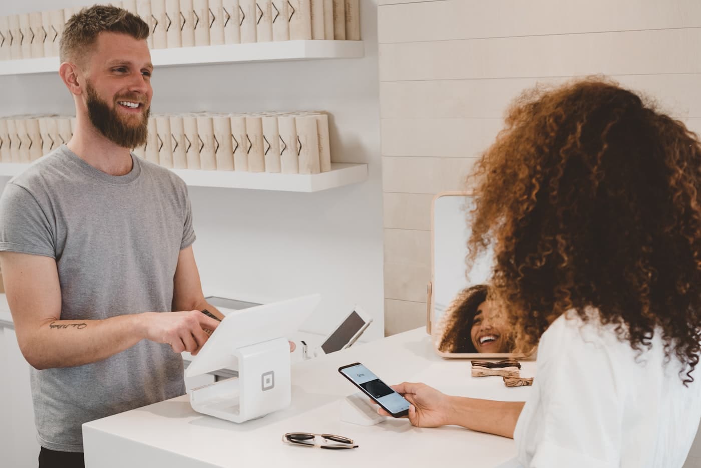 Customer paying with smartphone in store